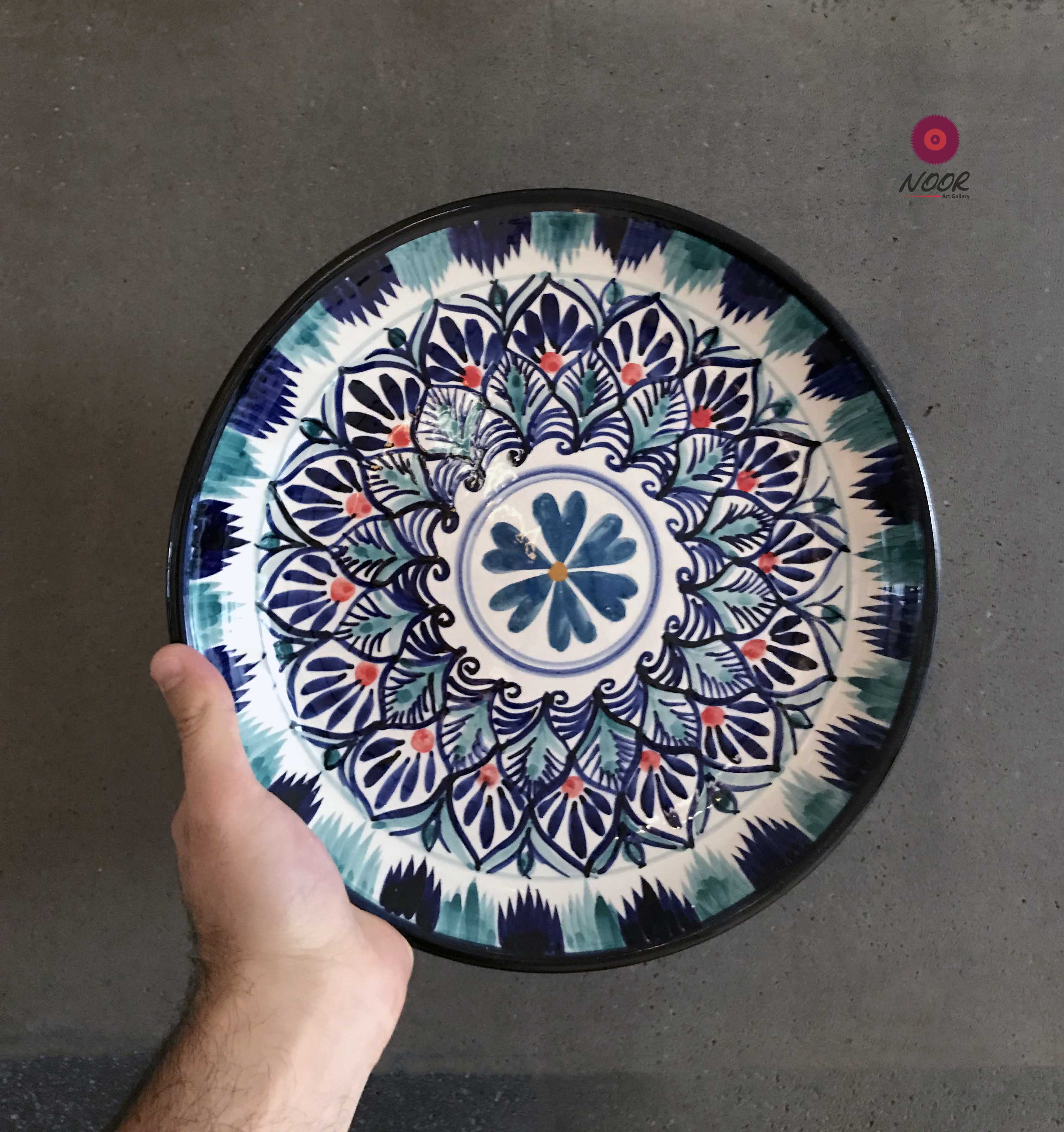 Glazed ceramic plates of handpainted with national patterns Noor art